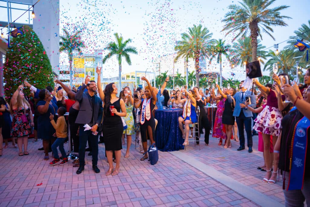 graduates toasting