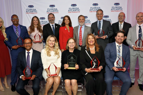From left, sitting: Ajay Vasanadu, MCE ’94; Jaclyn Klimczak, M.D. ’16; Maria Jasin, B.S. ’78; Madeline Pumariega, M.Ed. ’97; Patrick Martin, B.A. ’16; From left, standing: Katie G. Burke, Ph.D., ’08, ’10, ’15, ’17, assistant vice president of alumni and community engagement at FAU; Kirk Brown, B.A. ’98; Melissa Emerson, BSN ’04, MBA ’18; FAU Provost and Executive Vice President for Academic Affairs Ken Dawson-Scully, Ph.D.; FAU First Lady Jillian Hasner; FAU President Adam Hasner; Michael Balter, MBA ’89; Jose E. Garcia Jr., BGS ’25; Harrison Stubbs, B.A. ’14